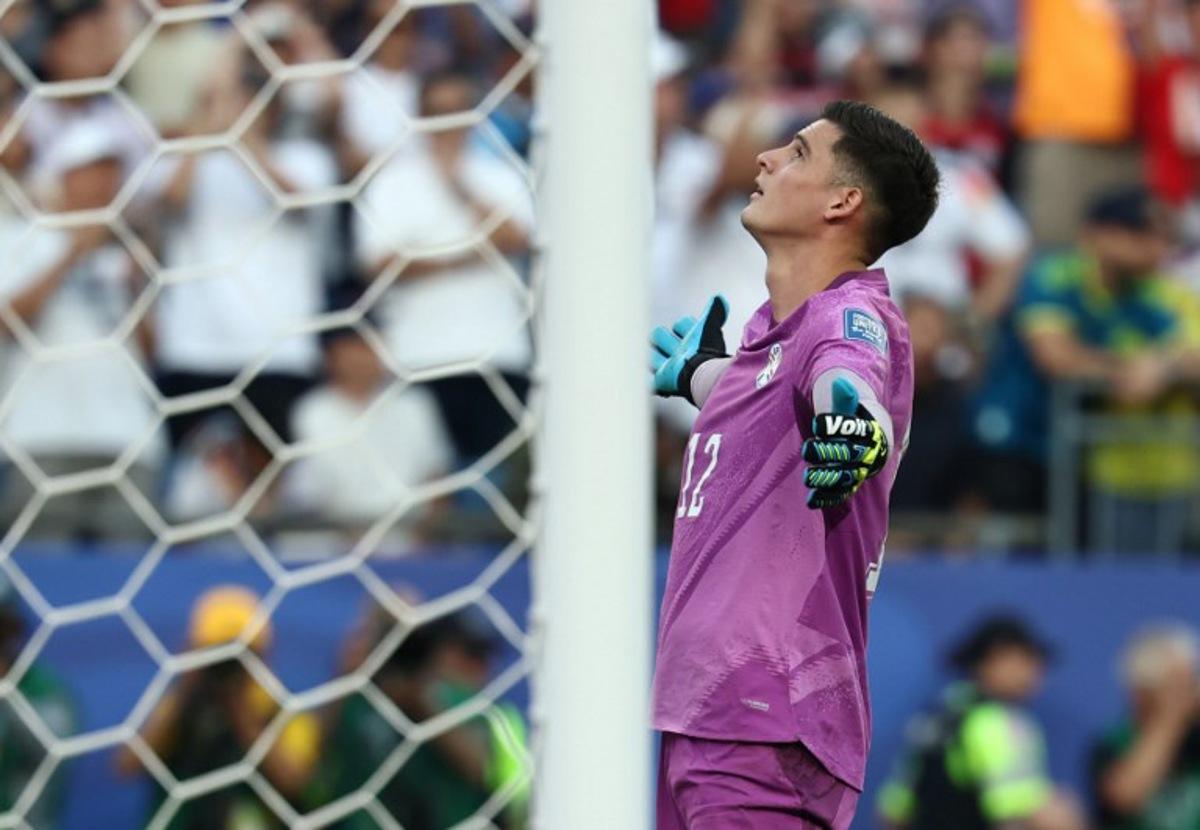 Paraguay's goalkeeper #12 Orlando Gill (L) reacts after saving a penalty by Germany's forward #11 Nick Woltemade (out of frame) in the shootout during the 2026 World Cup round of 32 football match between Germany and Paraguay at the Boston Stadium in Foxborough on June 29, 2026. FRANCK FIFE / AFP