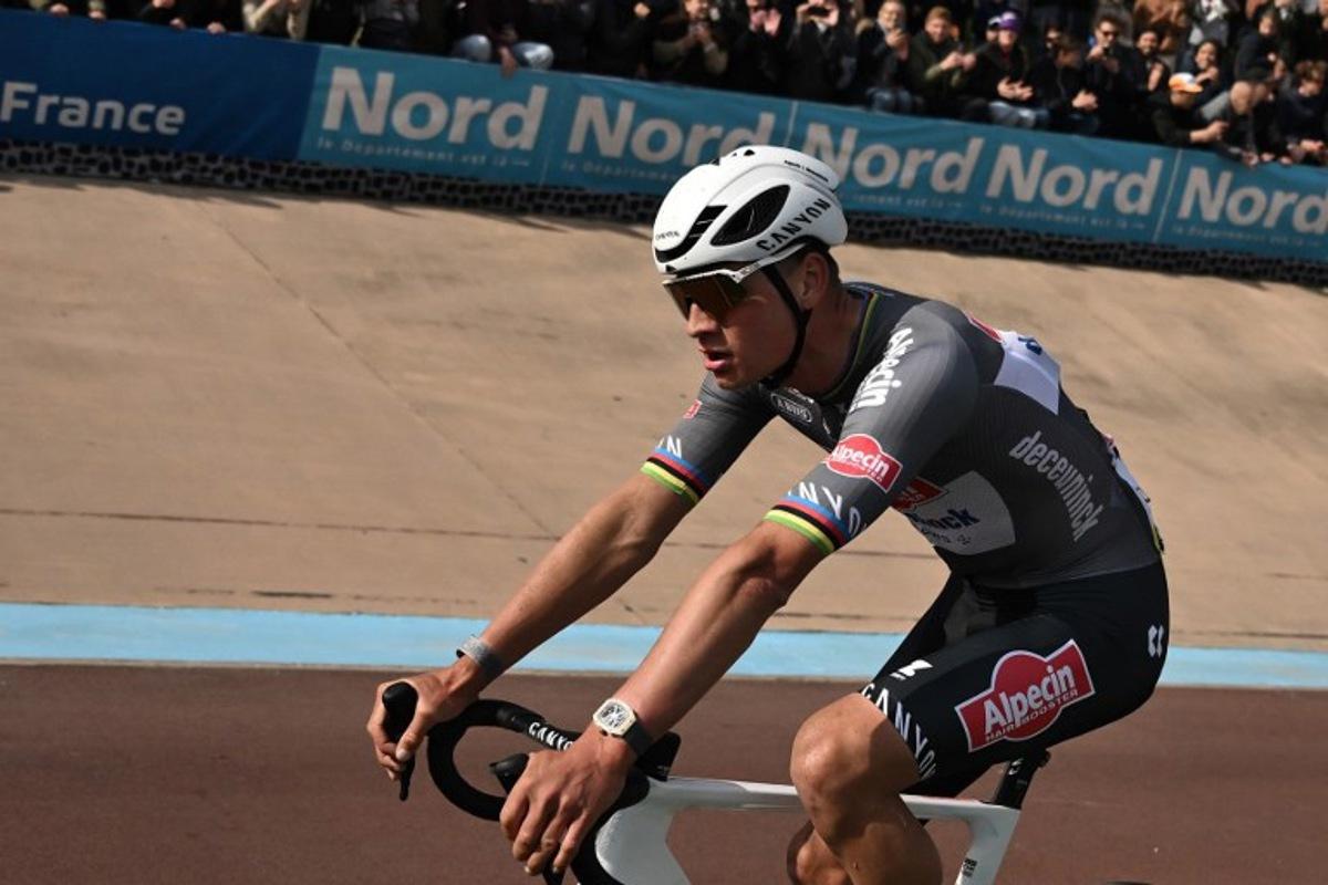 First placed Alpecin-Deceuninck's Dutch rider Mathieu van der Poel reacts after crossing the finish line to win the 122nd edition of the Paris-Roubaix one-day classic cycling race, 259,2 km between Compiegne and Roubaix, at the Vélodrome André-Pétrieux in Roubaix, northern France on April 13, 2025. Jeff PACHOUD / POOL / AFP