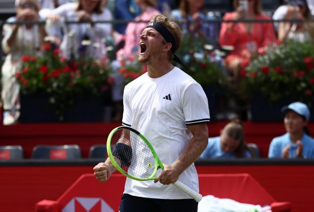 Spain's Alejandro Davidovich Fokina celebrates winning against France's Corentin Moutet in their men's singles round of 16 tennis match on day three of the ATP HSBC Championships at Queen's Club in west London on June 18, 2026. Fokina won the match 6-4, 6-3. Henry NICHOLLS / AFP