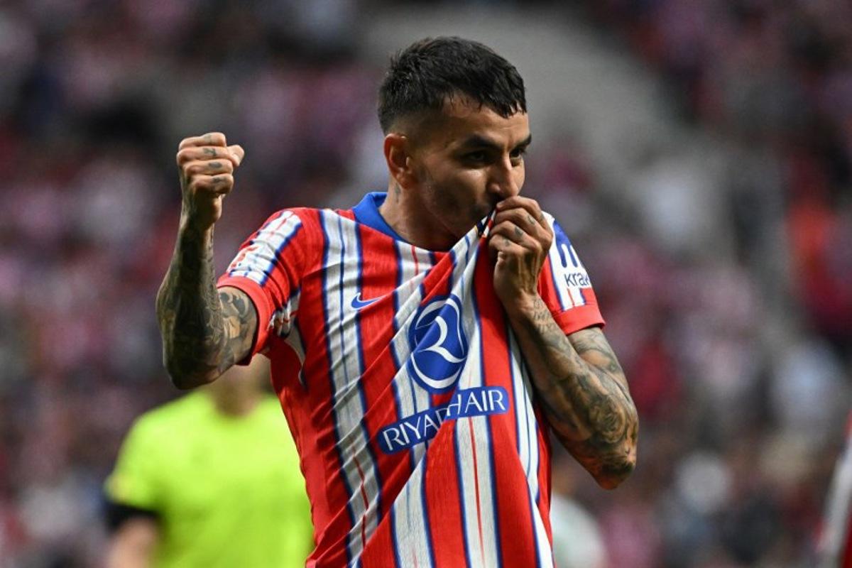 Atletico Madrid's Argentine forward #10 Angel Correa celebrates scoring his team's fourth goal during the Spanish league football match between Club Atletico de Madrid and Real Betis at Metropolitano Stadium in Madrid on May 18, 2025. JAVIER SORIANO / AFP