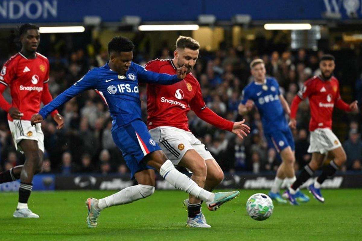 Chelsea's Brazilian midfielder #41 Estevao hurts himself having this shot during the English Premier League football match between Chelsea and Manchester United at Stamford Bridge in London on April 18, 2026. Glyn KIRK / AFP