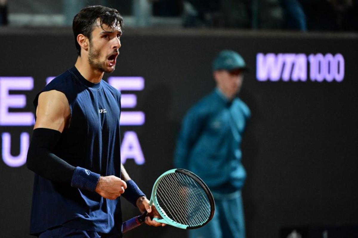 Italy's Lorenzo Musetti reacts during the men's singles quarter-final match against Germany's Alexander Zverev at the ATP Rome Open tennis tournament at Foro Italico in Rome on May 14, 2025. PIERO CRUCIATTI / AFP