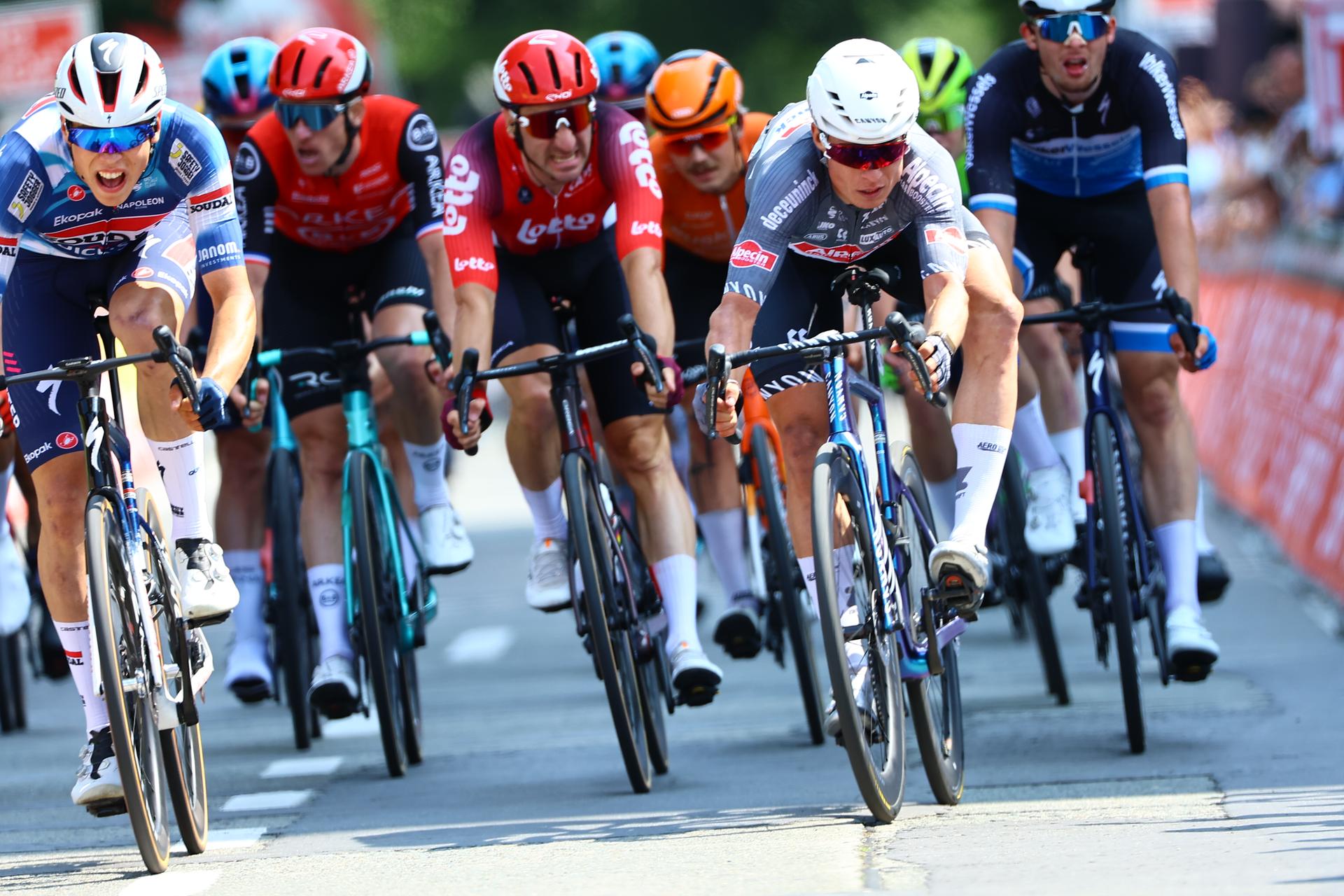 French Paul Magnier of Soudal Quick-Step and Belgian Jasper Philipsen of Alpecin-Deceuninck pictured in action during the Elfstedenronde one day cycling race, race 4 (out of 8) of the Lotto Belgium Cup, 196 km with start and finish in Brugge, Sunday 15 June 2025. BELGA PHOTO DAVID PINTENS