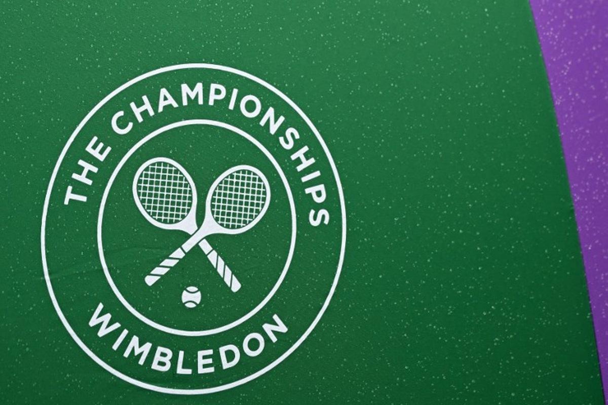 A Wimbledon umbrella is pictured on court 2 on the sixth day of the 2024 Wimbledon Championships at The All England Lawn Tennis and Croquet Club in Wimbledon, southwest London, on July 6, 2024. Glyn KIRK / AFP