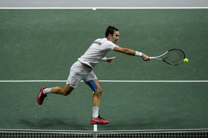 Kazakhstan's Mikhail Kukushkin returns the ball to Serbia's Miomir Kecmanovic during the men's singles quarter-final tennis match between Serbia and Kazakhstan of the Davis Cup tennis tournament at the Madrid arena in Madrid on December 1, 2021. OSCAR DEL POZO / AFP