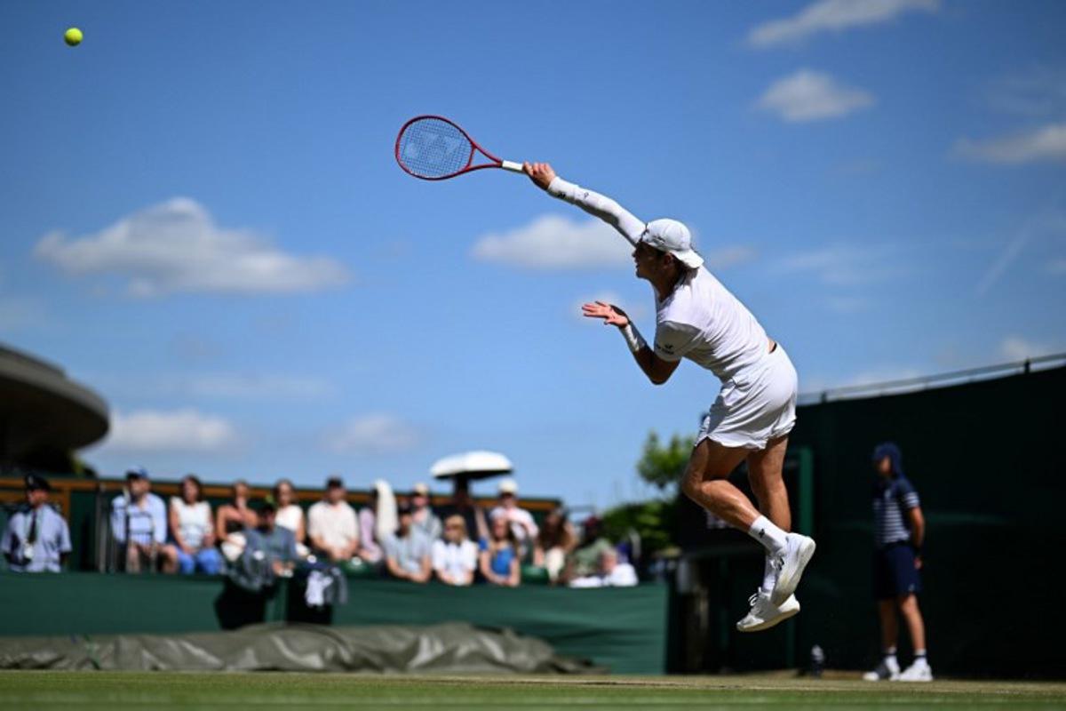 Belgium's Zizou Bergs serves against Britain's Arthur Fery during their men's singles third round tennis match on the sixth day of the 2026 Wimbledon Championships at The All England Lawn Tennis and Croquet Club in Wimbledon, southwest London, on July 4, 2026. Kirill KUDRYAVTSEV / AFP