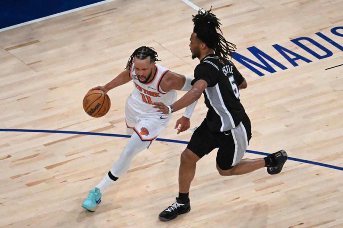 Knicks guard #11 Jalen Brunson and San Antonio Spurs' #05 Stephon Castle vie for the ball during Game Three of the NBA Finals between the San Antonio Spurs and the New York Knicks at Madison Square Garden in New York on June 8, 2026. SAUL LOEB / AFP