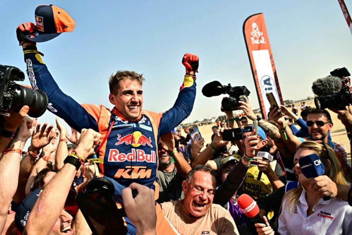 Argentine rider Luciano Benavides with a Ktm 450 Rally Factory celebrates after winning the 48th edition of the Dakar Rally 2026 in Yanbu, Saudi Arabia, on January 17, 2026. Giuseppe CACACE / AFP