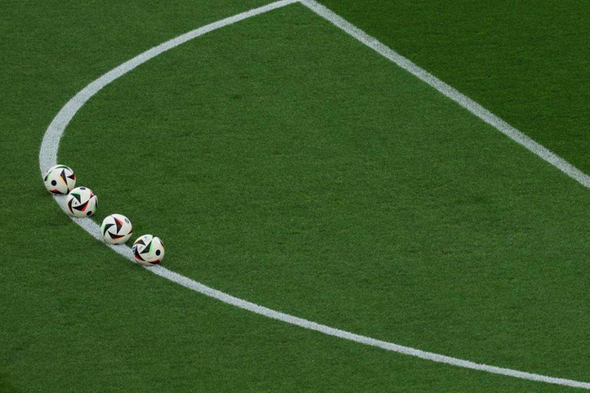 Match balls are set up for warm ups ahead of the UEFA Euro 2024 Group E football match between Ukraine and Belgium at the Stuttgart Arena in Stuttgart on June 26, 2024. LLUIS GENE / AFP