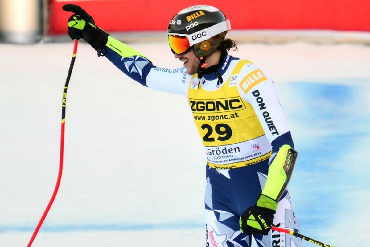 Czech Republic's Jan Zabystran celebrates after crossing the finish line of the men's Super G race during the FIS Alpine Ski World Cup, in Val Gardena, on December 19, 2025. Stefano RELLANDINI / AFP