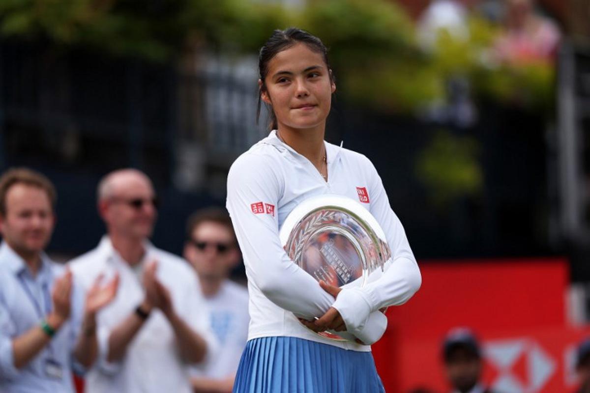 Britain's Emma Raducanu stands with the runners up trophy following her loss to Croatia's Donna Vekic after their women's singles final tennis match at the HSBC WTA Championships at Queen's Club in west London on June 14, 2026. Adrian Dennis / AFP