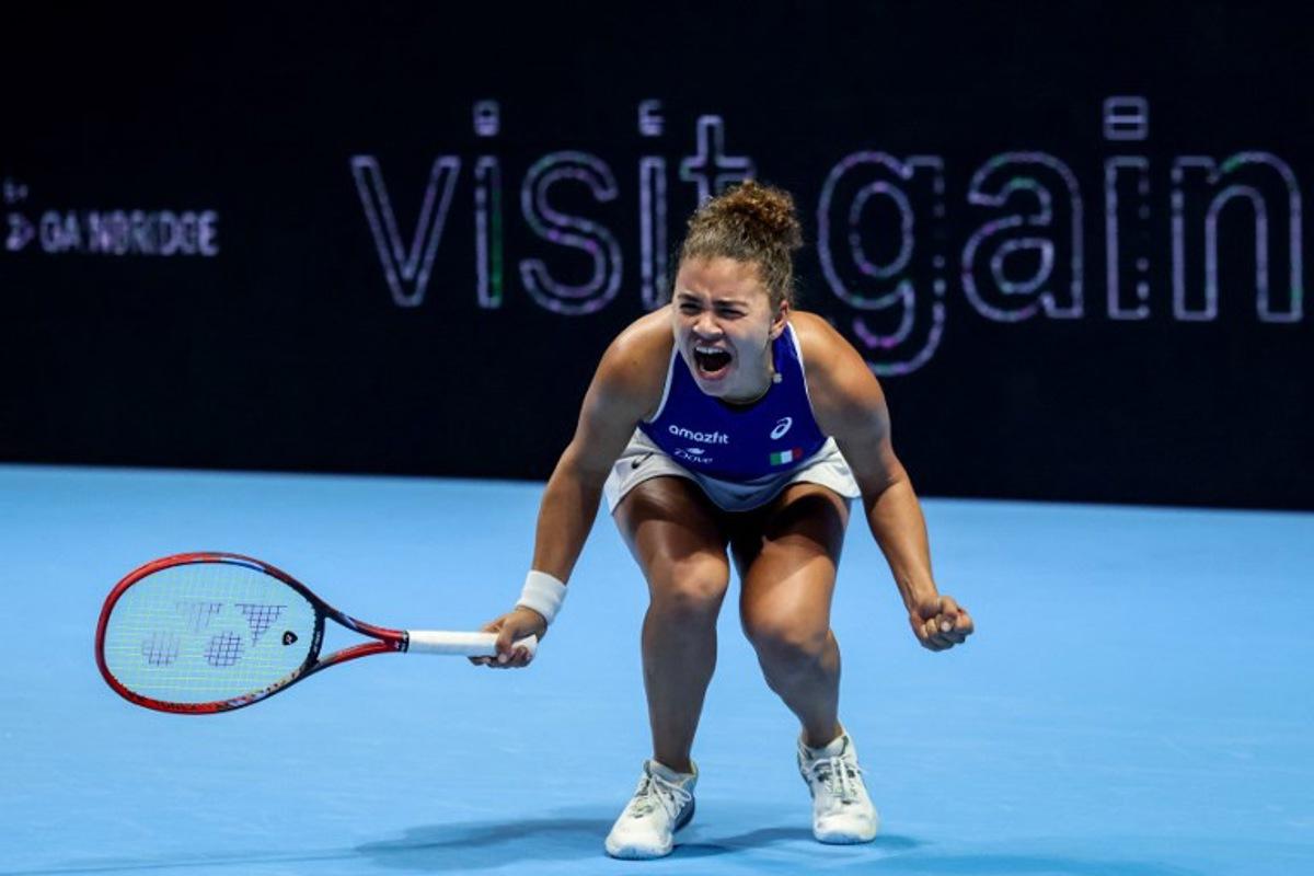 Italy's Jasmine Paolini reacts as she plays against Ukraine's Elina Svitolina during their second singles semi-final match at the Billie Jean King Cup in Shenzhen, southern China's Guangdong province on September 19, 2025. STR / AFP