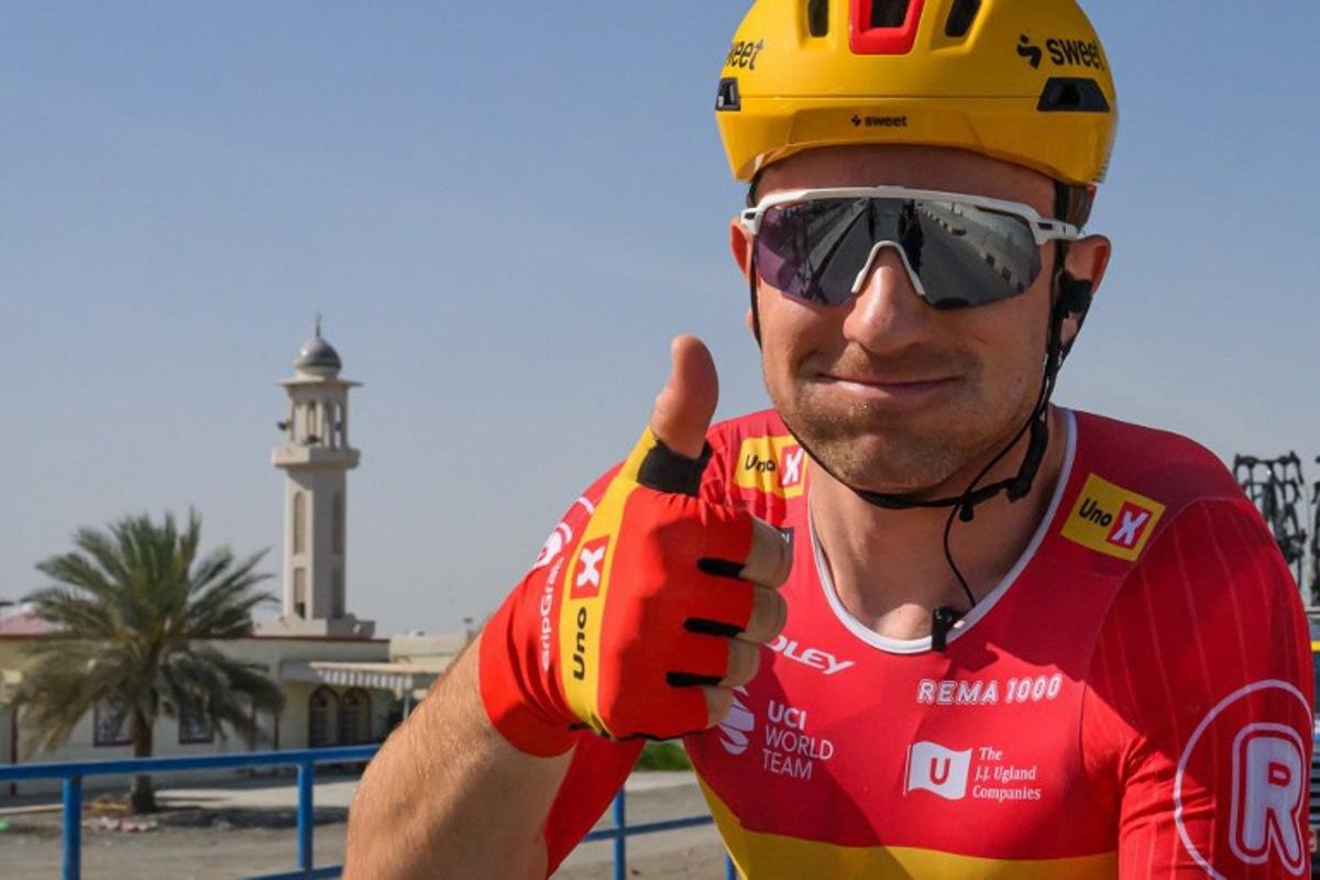 Uno-X Mobility Norvegian rider Erlend Blikra gives a thumb up after winning the 4th stage of the Tour of Oman cycling race from Al Sawadi to Sohar, on February 10, 2026. Loic VENANCE / AFP