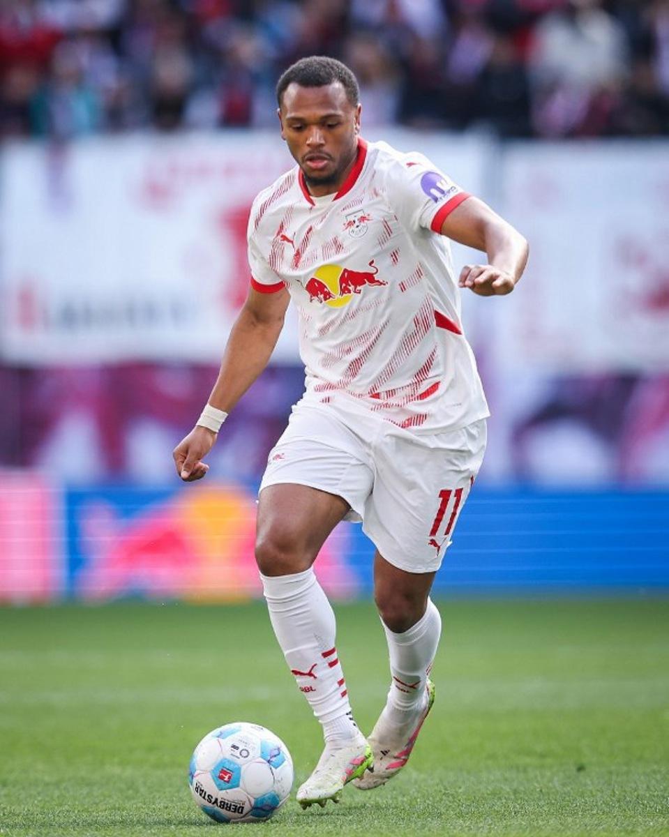 Leipzig's Belgian forward #11 Lois Openda plays the ball during the German first division Bundesliga football match between RB Leipzig and TSG 1899 Hoffenheim in Leipzig, eastern Germany on April 5, 2025. Ronny Hartmann / AFP