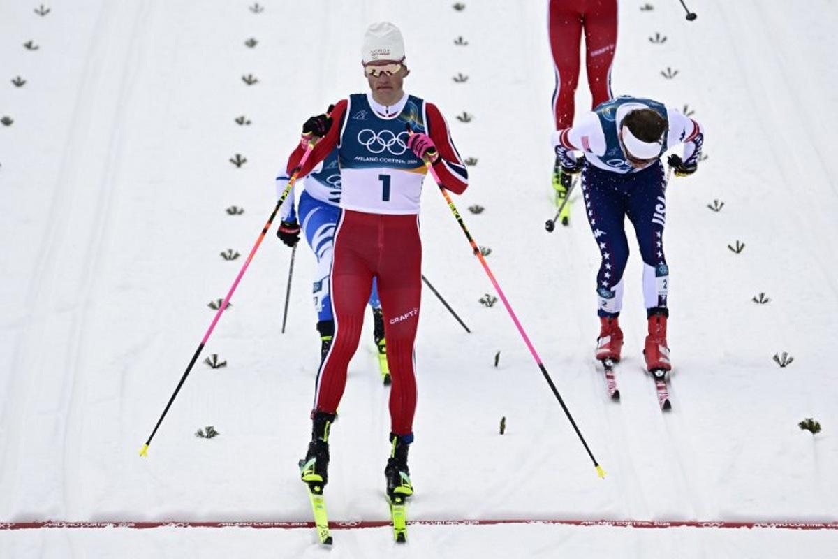 Norway's Johannes Hoesflot Klaebo crosses the finish to win in heat 1 of the men's cross country sprint classic semifinal event of the Milano Cortina 2026 Winter Olympic Games at Tesero Cross-Country Skiing Stadium in Lago di Tesero (Val di Fiemme), on February 10, 2026. Tobias SCHWARZ / AFP