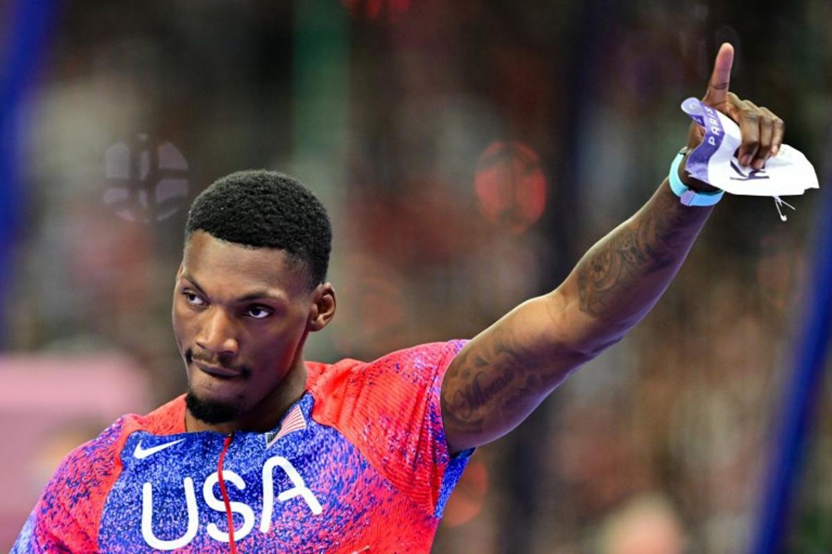 US' bronze medallists Fred Kerley celebrates after the men's 100m final of the athletics event at the Paris 2024 Olympic Games at Stade de France in Saint-Denis, north of Paris, on August 4, 2024. Martin BERNETTI / AFP