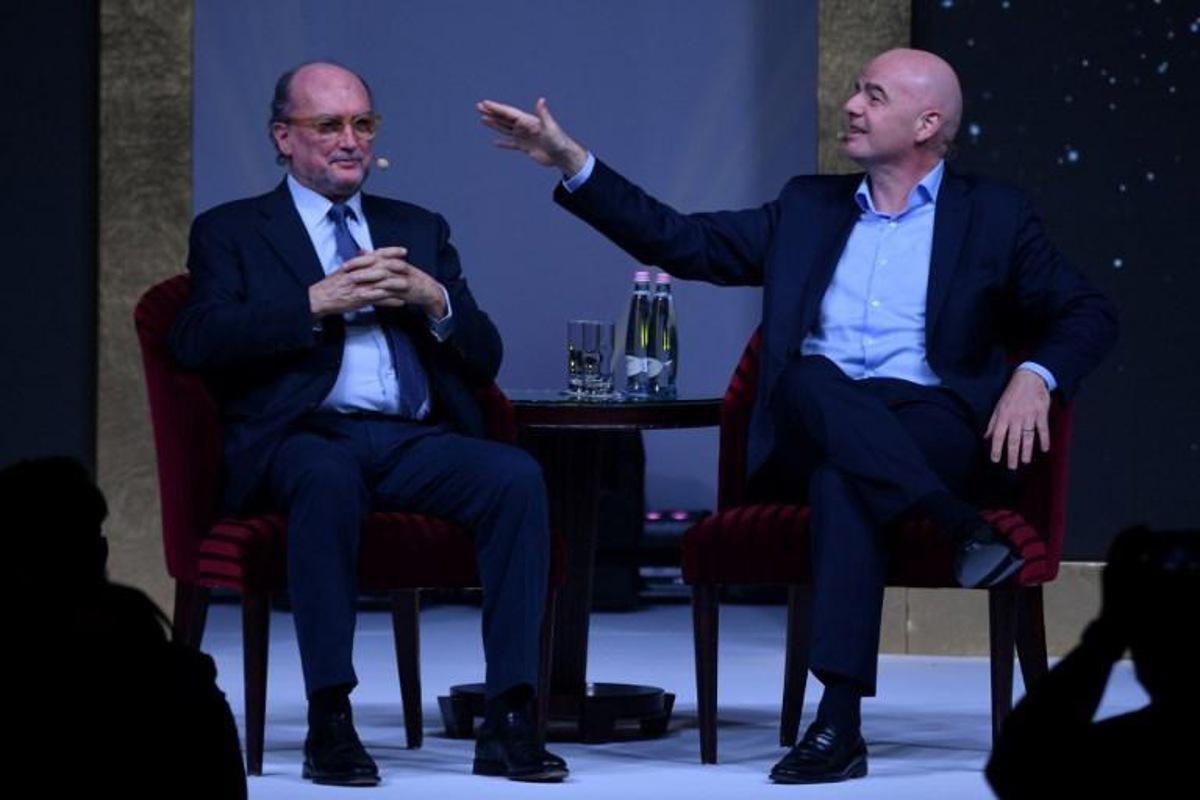 FIFA President Gianni Infantino talks with the President of the Association of International Sports Press (AIPS) Giovanni Merlo during a public debate with AIPS members as part of the association's annual congress on February 3, 2020 in Budapest, Hungary. Attila KISBENEDEK / AFP
