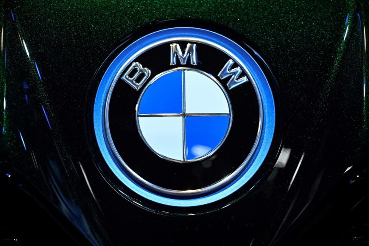 This photograph shows the logo of the German automotive industry "BMW" displayed at the Paris Motor Show at Paris Expo Porte de Versailles in Paris on October 16, 2024. JULIEN DE ROSA / AFP