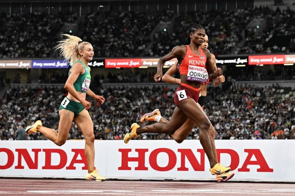 Australia's Jessica Hull (L) and Kenya's Lilian Odira run to the finish line in the women's 800m semi-final during the World Athletics Championships in Tokyo on September 19, 2025. Jewel SAMAD / AFP