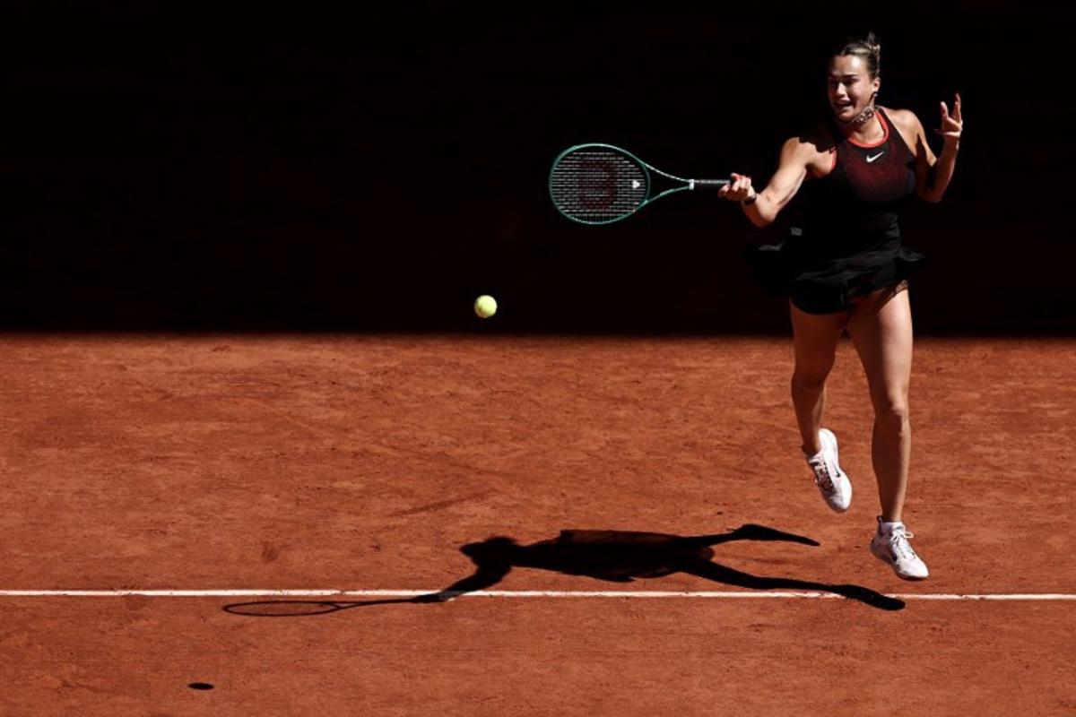 Belarus' Aryna Sabalenka plays a forehand return to Spain's Jessica Bouzas Maneiro during their women's singles match on day 3 of the French Open tennis tournament on Court Philippe-Chatrier at the Roland-Garros Complex in Paris on May 26, 2026. Anne-Christine POUJOULAT / AFP