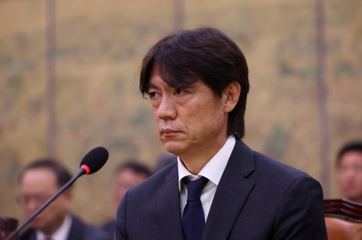 Former South Korean men's national team head coach Hong Myung-bo attends the hearing on the Korea Football Association (KFA) over a controversy surrounding its management at the National Assembly in Seoul on July 30, 2026. Hong, a former national team defender, resigned on July 26, after South Korea finished the World Cup 2026 group stage with one win and two losses, dashing hopes of a deep run led by captain Son Heung-min. Chung Sung-Jun / POOL / AFP