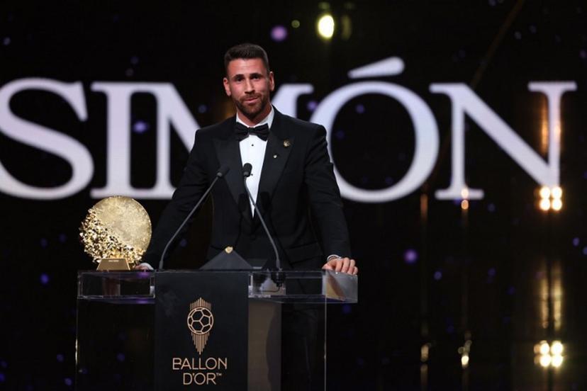 Spain's goalkeeper Unai Simon speaks after receiving the Yashin Trophy for the best male goalkeeper during the 2026 Ballon d'Or France Football award ceremony at the Palladium Theatre in London on October 26, 2026. FRANCK FIFE / AFP