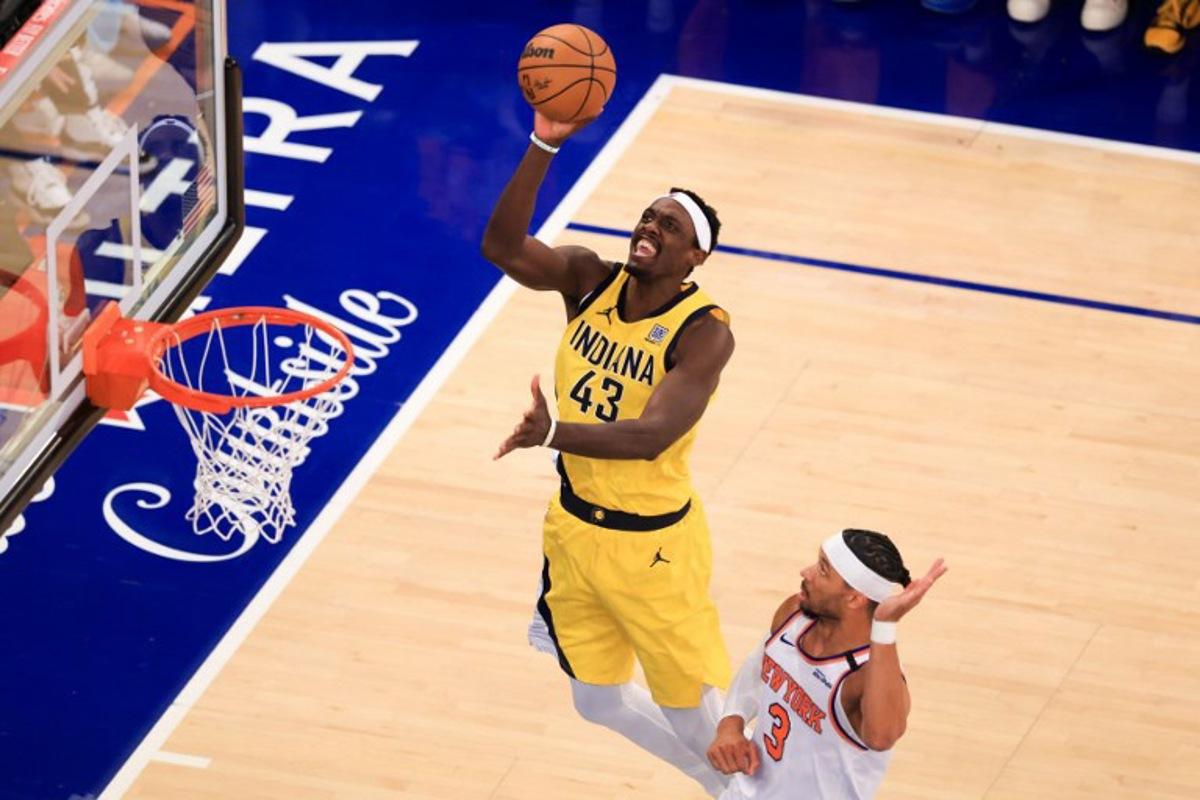 Indiana Pacers' power forward #43 Pascal Siakam jumps to shoot past Knicks' shooting guard #03 Josh Hart during Game Five of the Eastern Conference Finals of the 2025 NBA Playoffs between the New York Knicks and the Indiana Pacers at Madison Square Garden in New York on May 29, 2025. CHARLY TRIBALLEAU / AFP