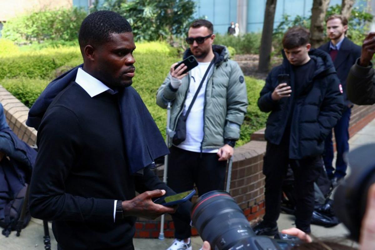 Former Arsenal midfielder Thomas Partey departs following his hearing at the Southwark Crown Court in London on April 13, 2026. Partey, who now plays for Spanish club Villarreal, was charged in February with two further counts of rape. Toby Shepheard / AFP