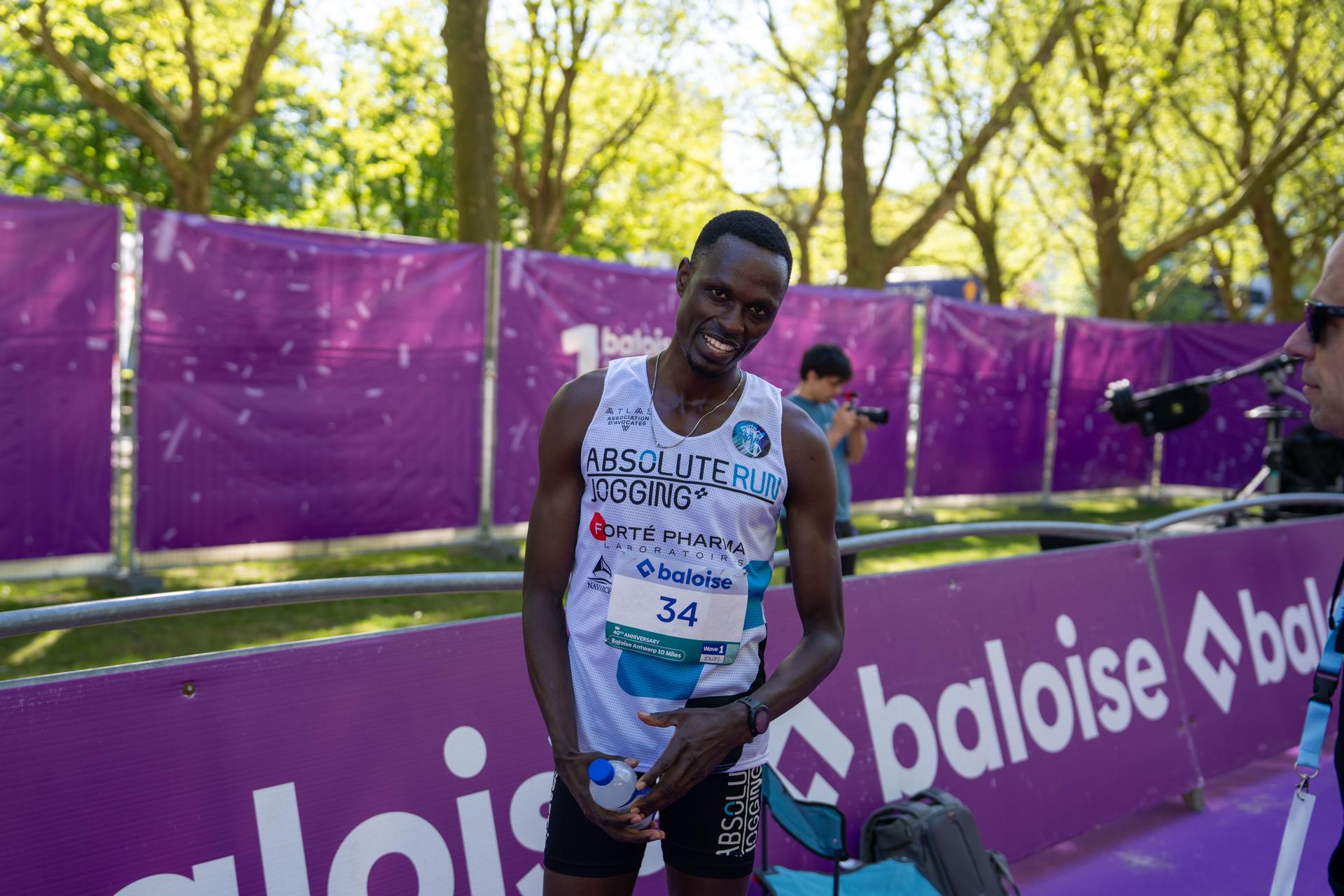 Patrick nimubona pictured at the finish line as he wins the Antwerp Ten Miles running event, Sunday 26 April 2026 in Antwerp. BELGA PHOTO MARIUS BURGELMAN