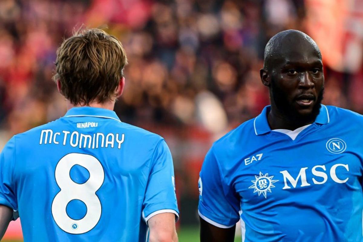 Napoli's Scottish midfielder #8 Scott McTominay (L) celebrates with Napoli's Belgian forward #11 Romelu Lukaku after scoring his team first goal during the Italian Serie A football match between AC Monza and Napoli SSC at the Brianteo Stadium in Monza, northern Italy, on April 19, 2025. Piero CRUCIATTI / AFP