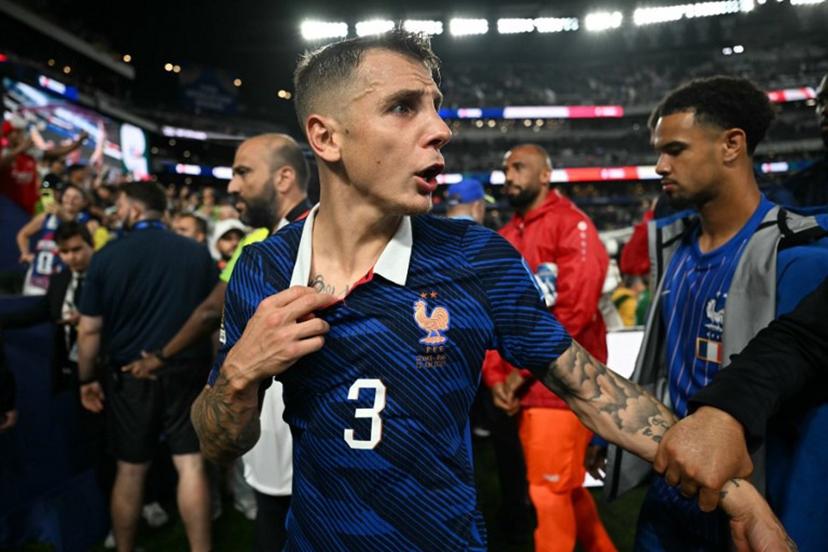 France's defender #03 Lucas Digne gestures as he leaves the pitch after winning the 2026 World Cup Group I football match between France and Iraq at the Philadelphia Stadium in Philadelphia on June 22, 2026. MAURO PIMENTEL / AFP