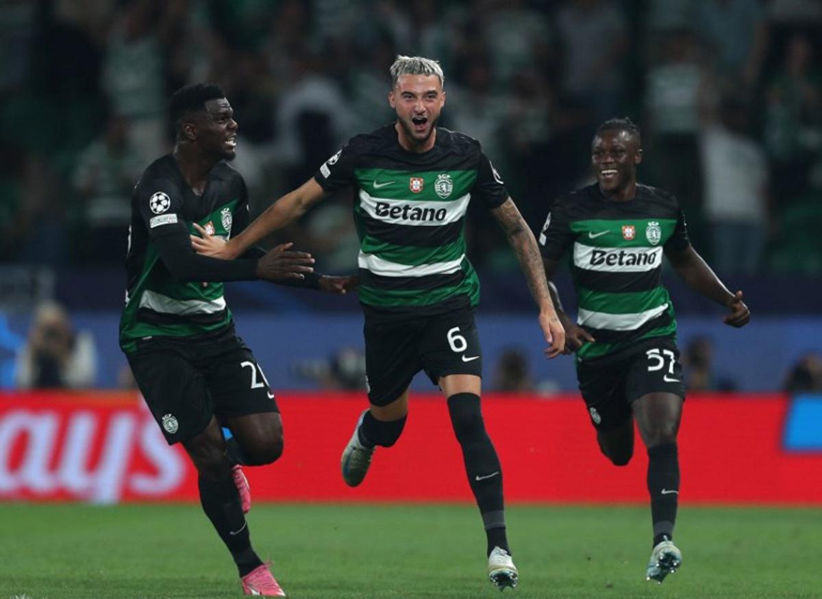 Sporting Lisbon's Belgian defender #06 Zeno Debast celebrates with Sporting Lisbon's Ivorian defender #26 Ousmane Diomande and Sporting Lisbon's Portuguese forward #57 Geovany Quenda scoring his team's second goal during the UEFA Champions League 1st round day 1 football match between Sporting CP and LOSC Lille, at Alvalade stadium in Lisbon, on September 17, 2024. CARLOS COSTA / AFP