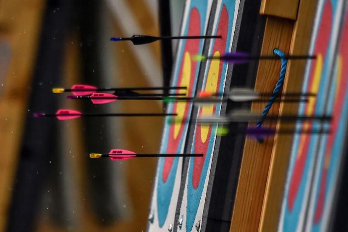 Picture of targets and arrows taken during the Women's Archery Compound Team final during the 2018 Central American and Caribbean Games (CAC), in Barranquilla, Colombia, on July 31, 2018. Luis ROBAYO / AFP