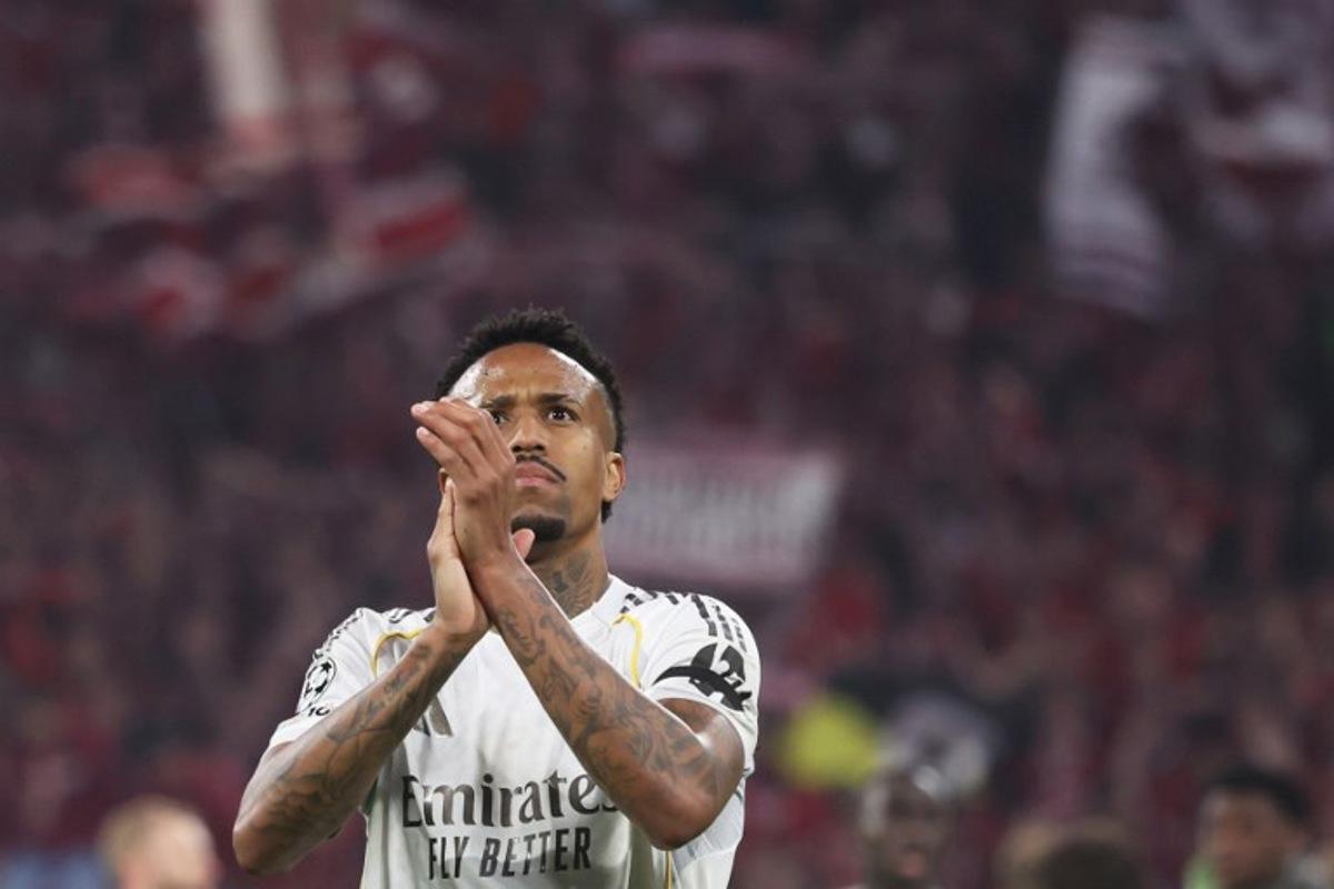 Real Madrid's Brazilian defender #03 Eder Militao greets the fans after the end of the UEFA Champions League quarter-final second leg football match between FC Bayern Munich and Real Madrid in Munich, southern Germany, on April 15, 2026. Karl-Josef HILDENBRAND / AFP