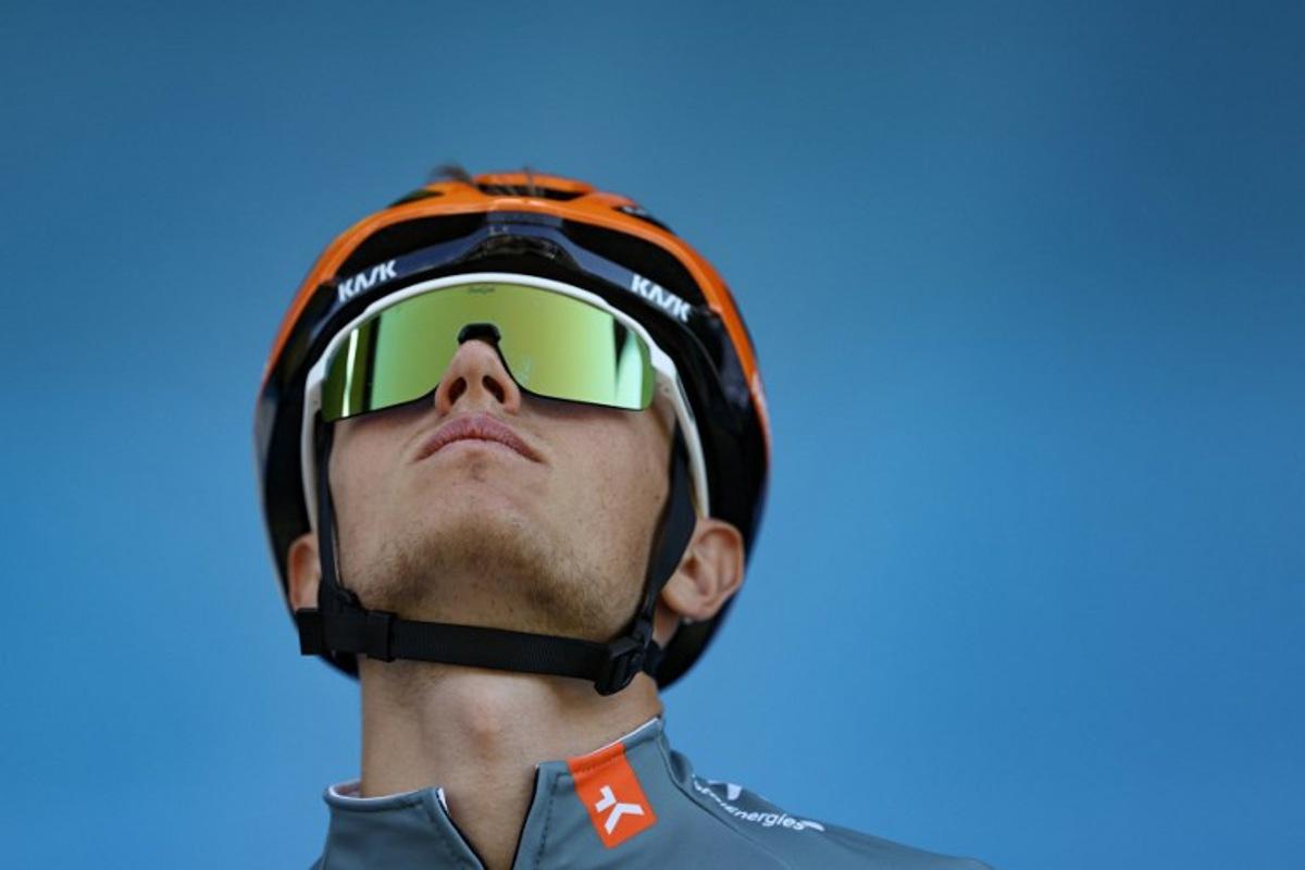 Netcompany Ineos Cycling Team's British rider Oscar Onley awaits the start of the 2nd stage of the Tour Auvergne-Rhone-Alpes cycling race (formerly known as the Criterium du Dauphine), 234,3km between Saint-Martin-Le-Vinoux and Le Puy-en-Velay, in the French Alps, on June 8, 2026. Anne-Christine POUJOULAT / AFP