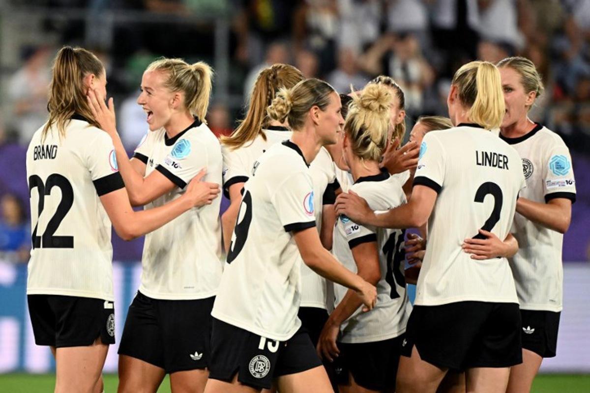 Germany's forward #11 Lea Schueller (2nd L) celebrate with teammates after scoring the team's second goal during the UEFA Women's Euro 2025 Group C football match between Germany and Poland at the Arena St.Gallen in St.Gallen on July 4, 2025. SEBASTIEN BOZON / AFP
