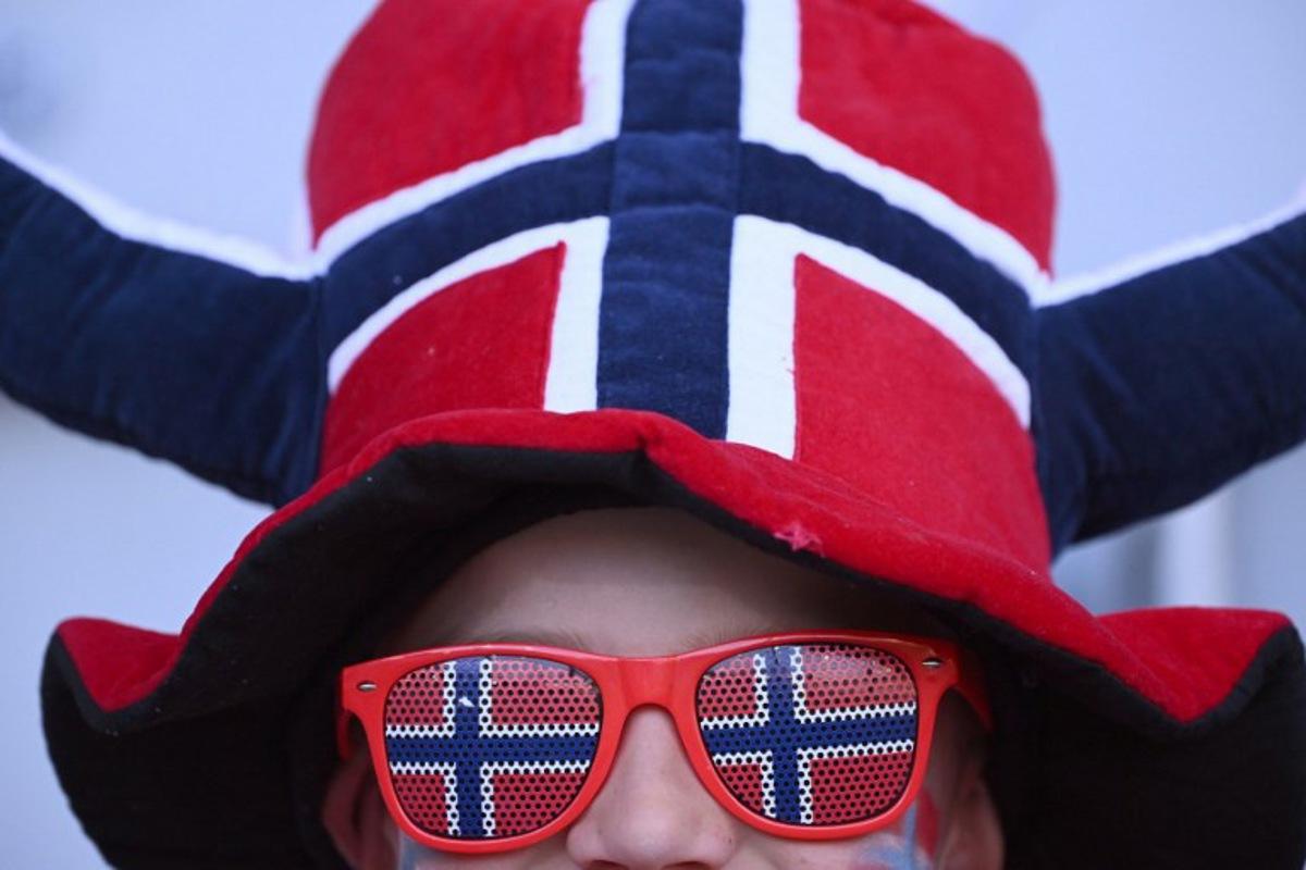 A Norway fan waits for the start of the UEFA Women's Euro 2025 Group A football match between Norway and Iceland at the Arena Thun stadium in Thun on July 10, 2025. SEBASTIEN BOZON / AFP