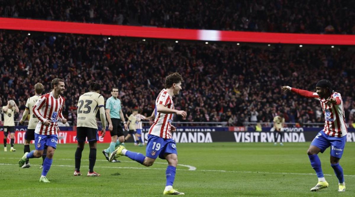Atletico Madrid's Argentine forward #19 Julian Alvarez (2R) celebrates scoring his team's fourth goal during the Spanish Copa del Rey (King's Cup) semi final first leg football match between Club Atletico de Madrid and FC Barcelona at Metropolitano Stadium in Madrid on February 12, 2026. Oscar DEL POZO / AFP