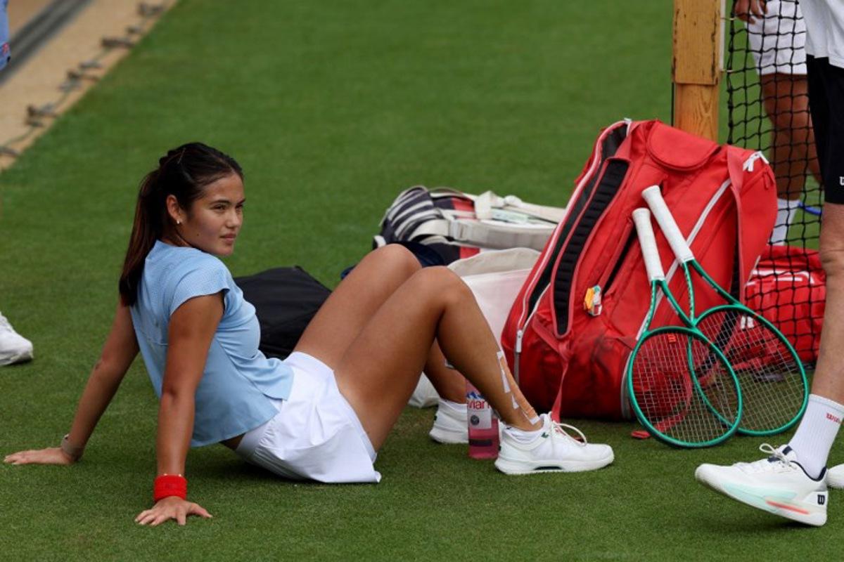 Britain's Emma Raducanu relaxes at the practice courts at The All England Lawn Tennis and Croquet Club in Wimbledon, southwest London, on June 28, 2026, ahead of the 2026 Wimbledon Championships. Adrian Dennis / AFP