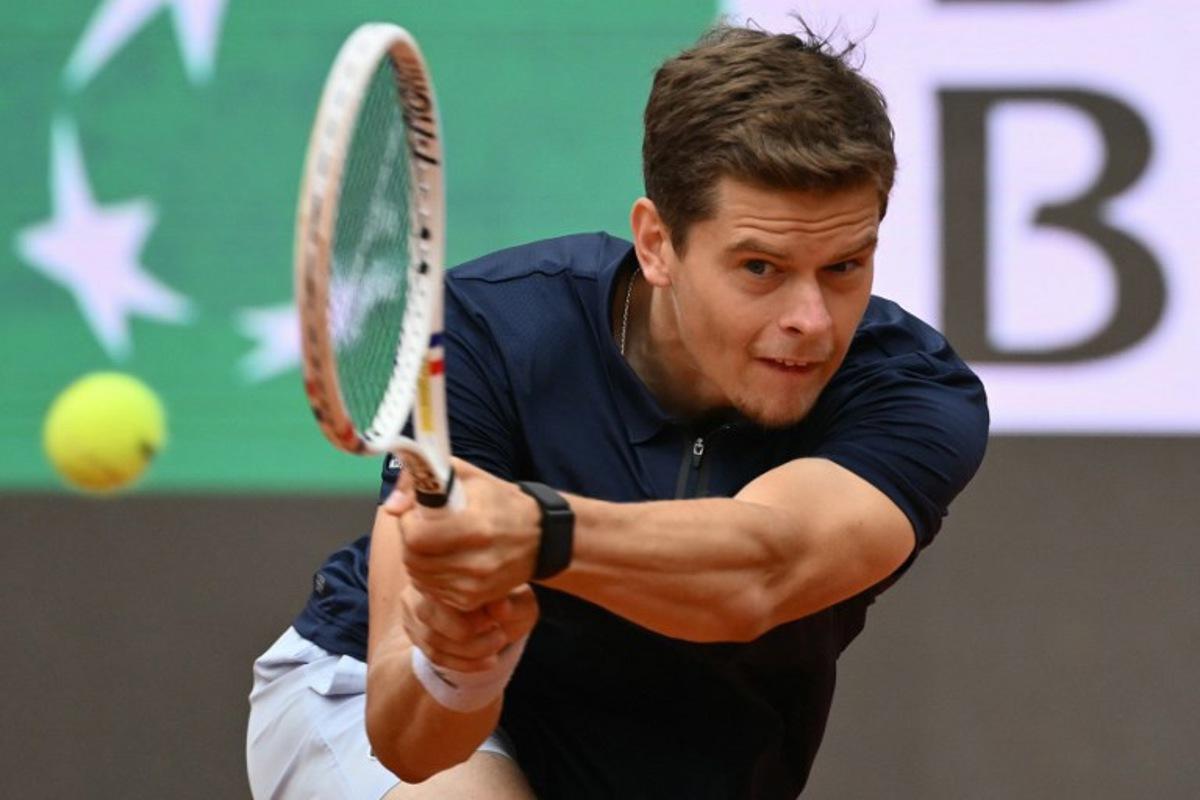 Belgium's Alexander Blockx hits a return to Germany's Alexander Zverev during their men's singles match at the ATP Rome Open tennis tournament at Foro Italico in Rome on May 10, 2026. Alberto PIZZOLI / AFP