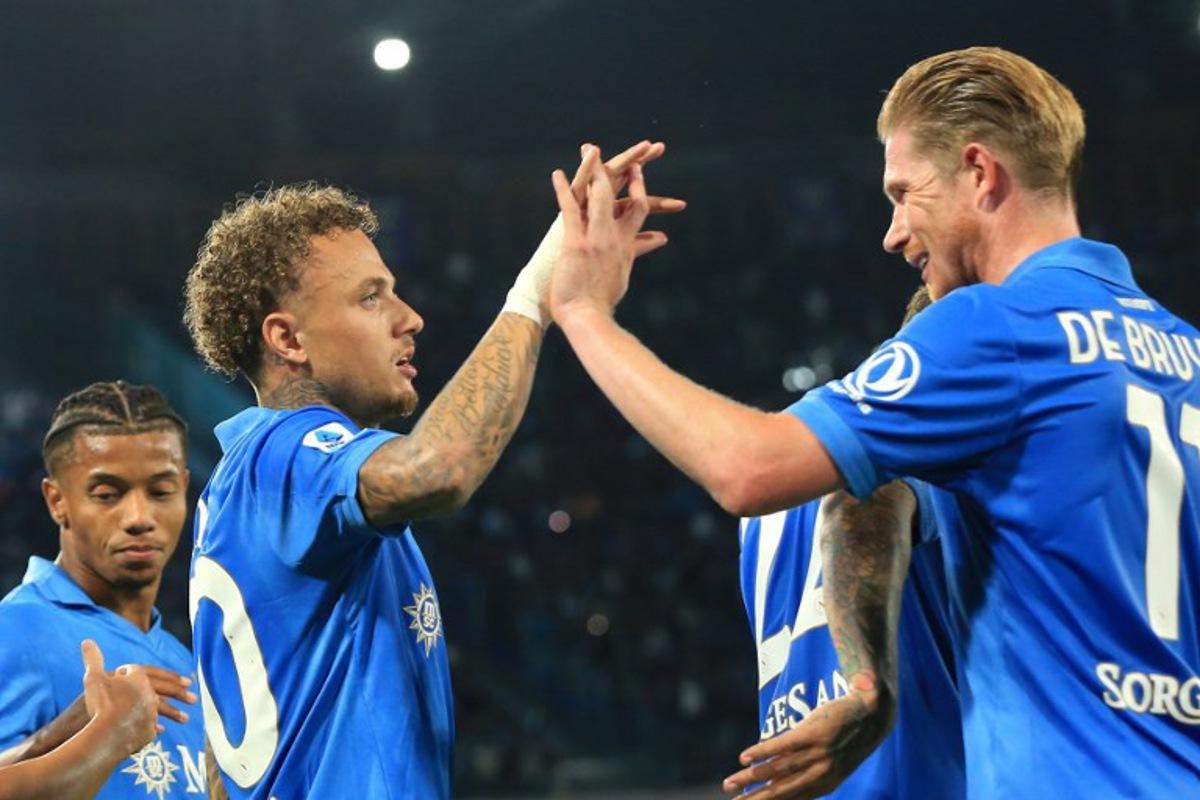Napoli's Dutch forward #70 Noa Lang (L) celebrates with Napoli's Belgian midfielder #11 Kevin De Bruyne (R) after scoring a goal during the Italian Serie A football match between Napoli and Frosinone Calcio at the Diego Armando Maradona Stadium in Naples, on October 10, 2026. CARLO HERMANN / AFP