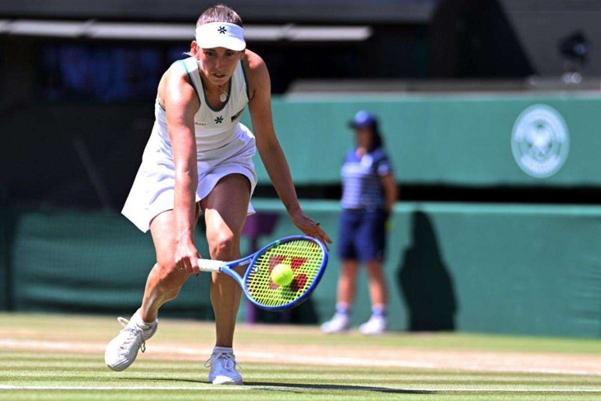 Belgium's Elise Mertens returns to Czech Republic's Linda Noskova during their women's singles quarter-final tennis match on the tenth day of the 2026 Wimbledon Championships at The All England Lawn Tennis and Croquet Club in Wimbledon, southwest London, on July 8, 2026. Kirill KUDRYAVTSEV / AFP