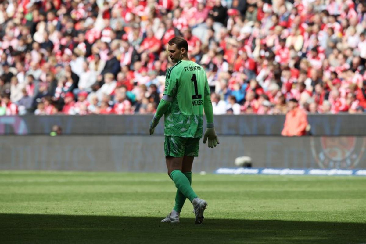 Bayern Munich's German goalkeeper #01 Manuel Neuer walks and looks down on the pitch during the German first division Bundesliga football match between FC Bayern Munich and FC Cologne in Munich, southern Germany, on May 16, 2026. Alexandra BEIER / AFP