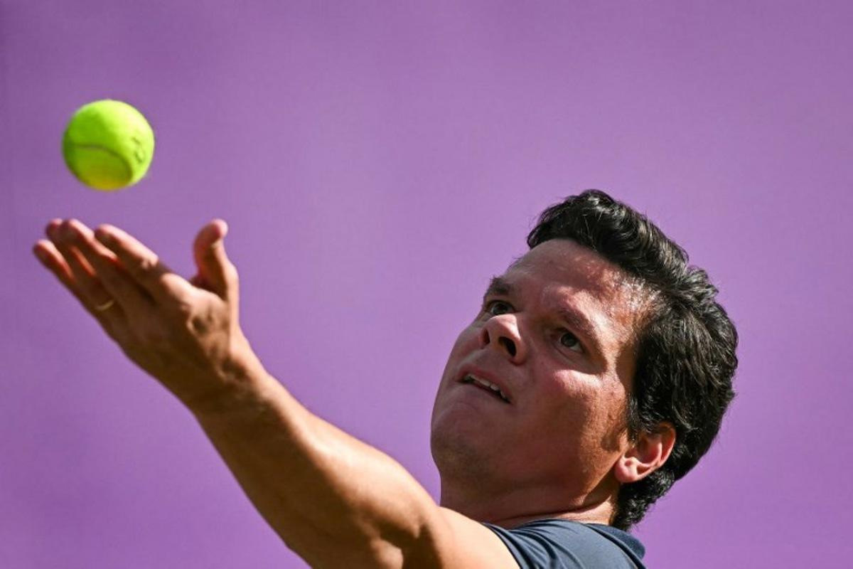 Canada's Milos Raonic serves against US player Taylor Fritz during their men's singles round of 16 match at the Cinch ATP tennis Championships at Queen's Club in west London on June 19, 2024. Ben Stansall / AFP