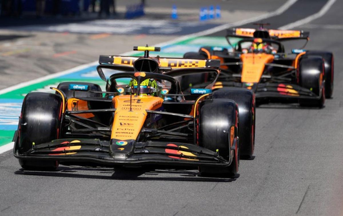 McLaren's British driver Lando Norris (L) and McLaren's Australian driver Oscar Piastri drive during the qualifying session at the Red Bull Ring race track in Spielberg, Austria, on June 28, 2025, ahead of the Formula One Austrian Grand Prix. Darko Bandic / POOL / AFP