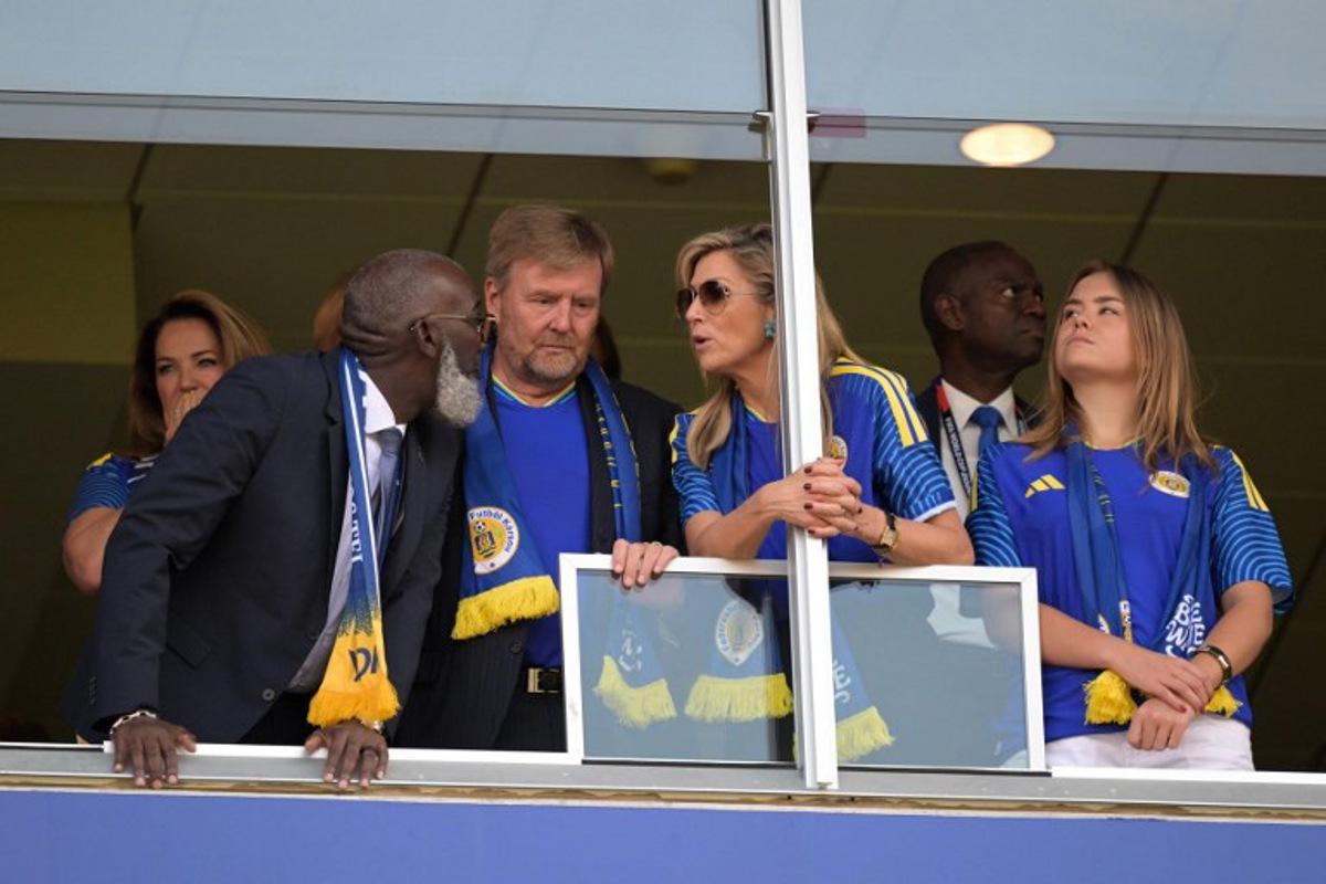 Curacao's Prime Minister Gilmar Pisas (L) talks with King Willem-Alexander of the Netherlands, Queen Maxima of the Netherlands and Princess Ariane of the Netherlands ahead of the 2026 World Cup Group E football match between Ecuador and Curacao at the Kansas City Stadium in Kansas City on June 20, 2026. JUAN MABROMATA / AFP