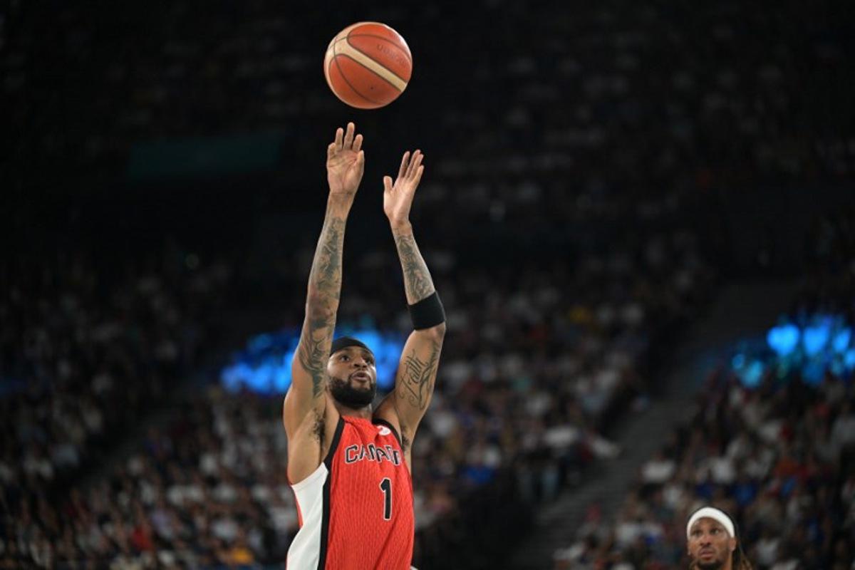Canada's #01 Nickeil Alexander-Walker takes a shot in the men's quarterfinal basketball match between France and Canada during the Paris 2024 Olympic Games at the Bercy Arena in Paris on August 6, 2024. Damien MEYER / AFP