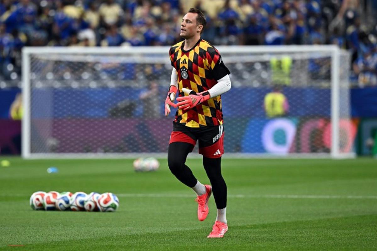 Germany's goalkeeper #01 Manuel Neuer takes part in the warm-up ahead of the 2026 World Cup Group E football match between Germany and Curacao at the Houston Stadium in Houston on June 14, 2026. Paul ELLIS / AFP