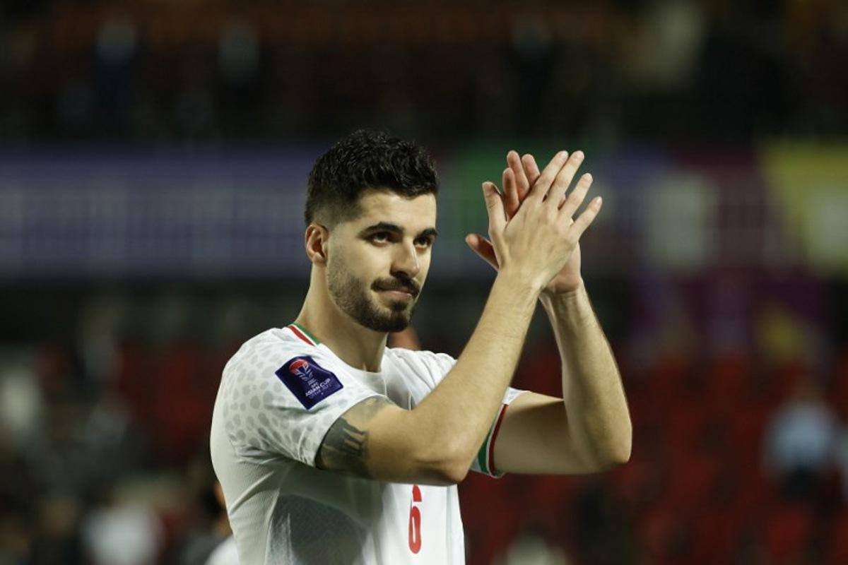 Iran's midfielder #06 Saeid Ezatolahi applauds the fans at the end of the Qatar 2023 AFC Asian Cup football match between Iran and Syria at the Abdullah bin Khalifa Stadium in Doha on January 31, 2024. KARIM JAAFAR / AFP