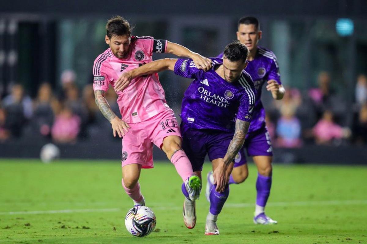 Inter Miami's Argentine forward #10 Lionel Messi fights for the ball with Orlando City's Slovenian defender #04 David Brekalo during the Leagues Cup semi-final football match between Inter Miami CF and Orlando City SC at Chase Stadium in Fort Lauderdale, Florida, on August 27, 2025. Chris Arjoon / AFP